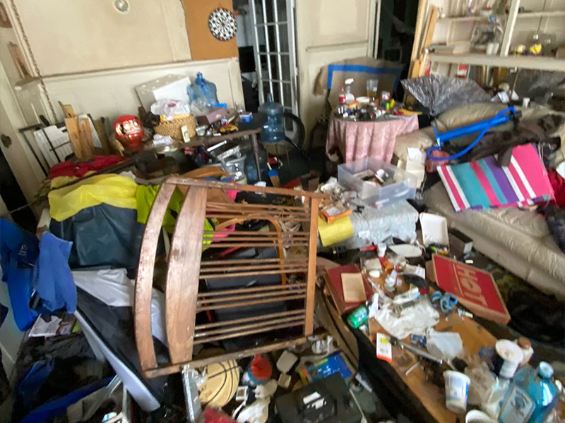 Cluttered room in need of cleanout and removal services by Oahu Dump Run