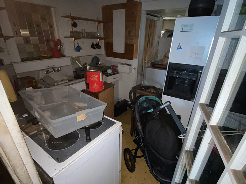Cluttered kitchen needed for cleanout and appliance removal services by Oahu Dump Run