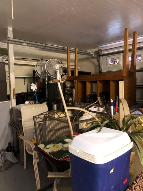 Cluttered garage that is in need of a garage cleanout service by Oahu Dump Run