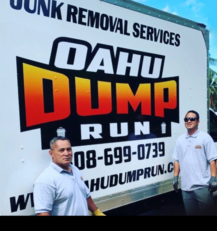 Oahu Dump Run crew confidently posing in front of the truck before doing junk removal